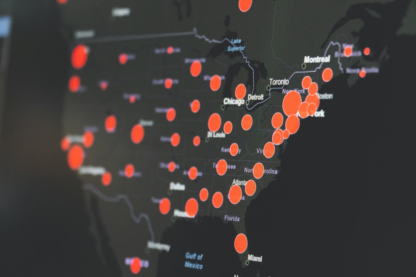 Digital map of North America with red data points.